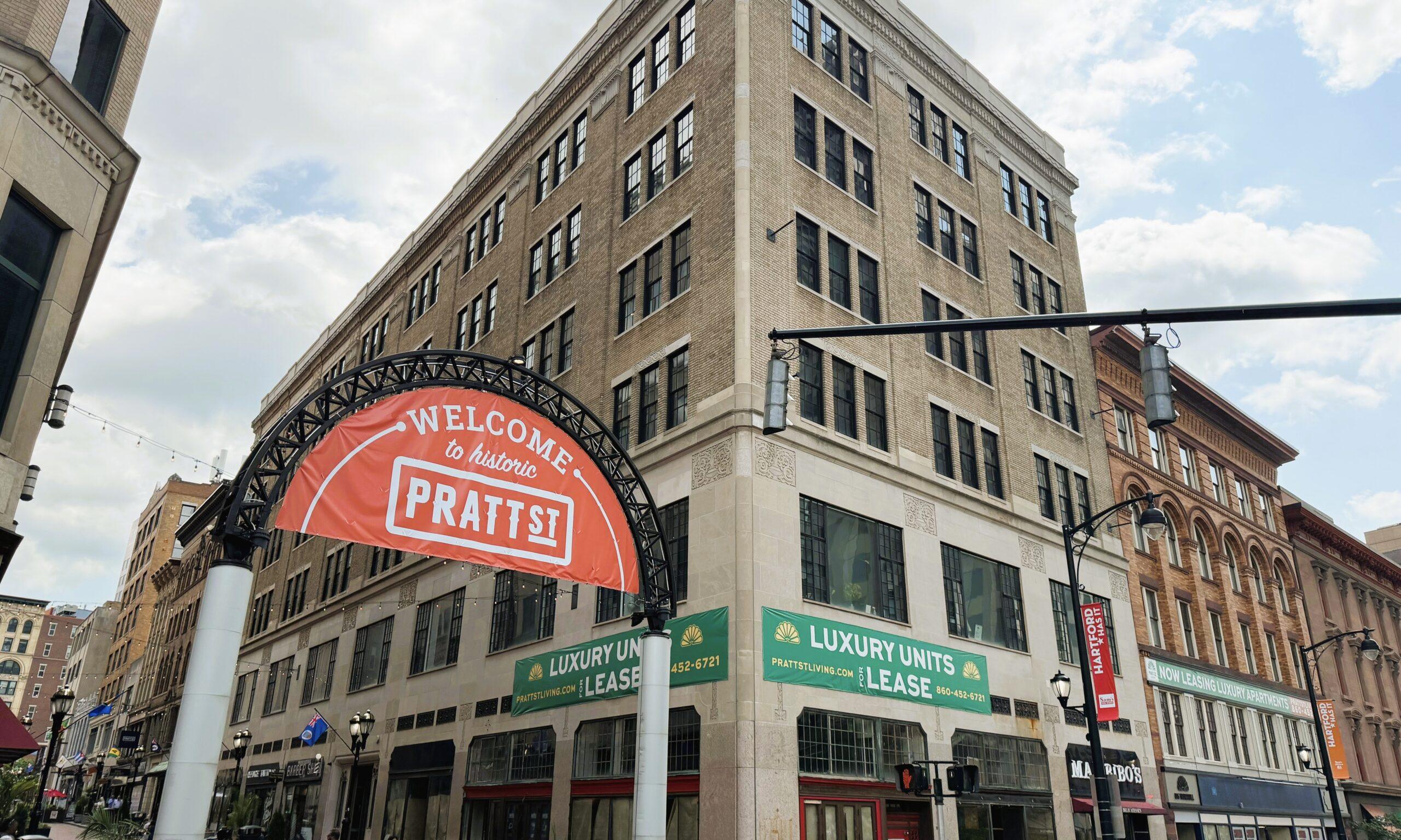 99 Pratt Street building Corner of the historic Pratt Street building with a red welcome arch and green leasing awnings