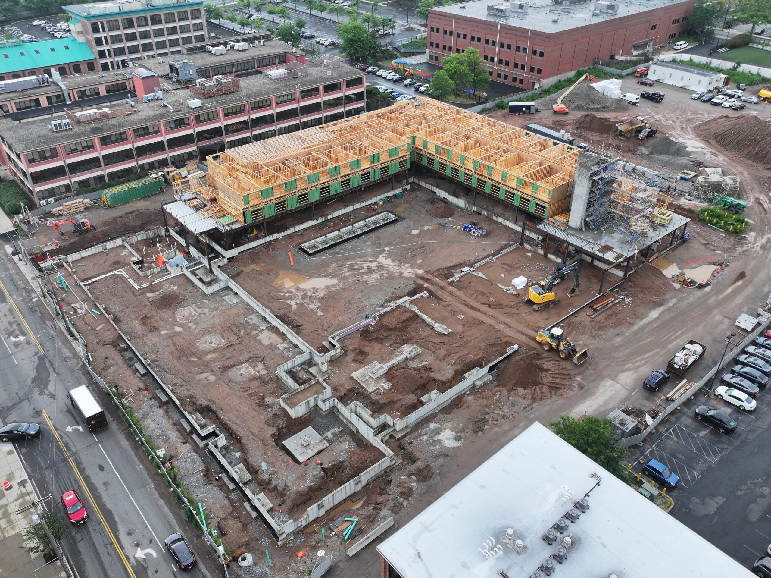 Aerial view of The Winston construction site Aerial view of an apartment construction site showing the concrete podium and early wood framing around a courtyard