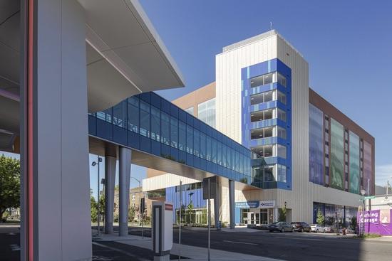LPRI CCMC Garage Walkway Exterior Exterior of the LPRI CCMC garage with an elevated glass skybridge connecting the buildings above the street
