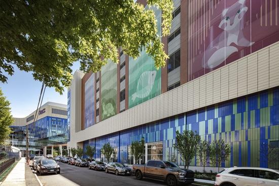 LPRI CCMC Garage Side View Side view of the LPRI CCMC garage with a colorful mural and blue glass framed by trees